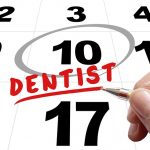 Your dentist in Holly Springs reminds customers to use their dental insurance